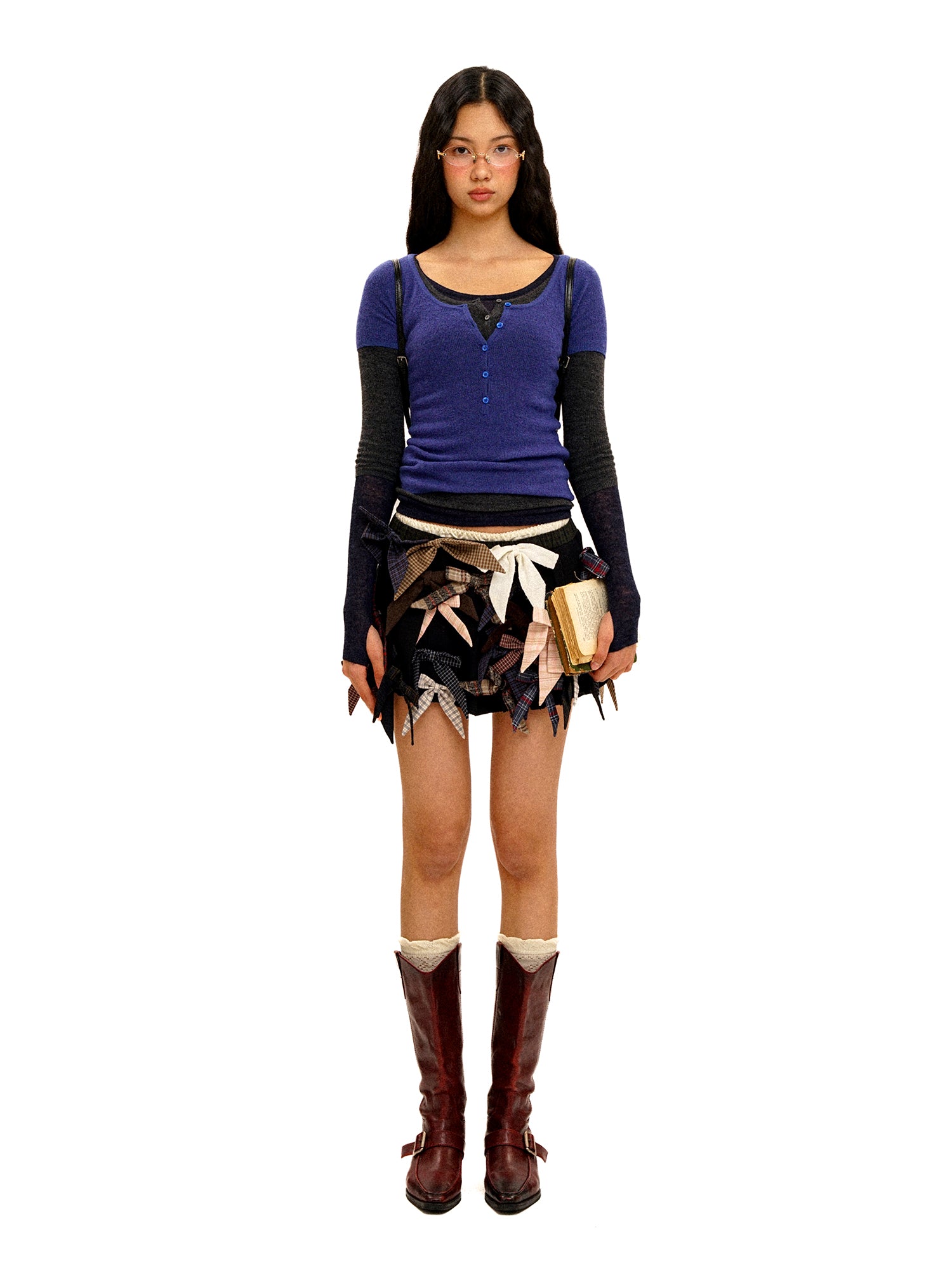 *Multi-bow pleated mini skirt