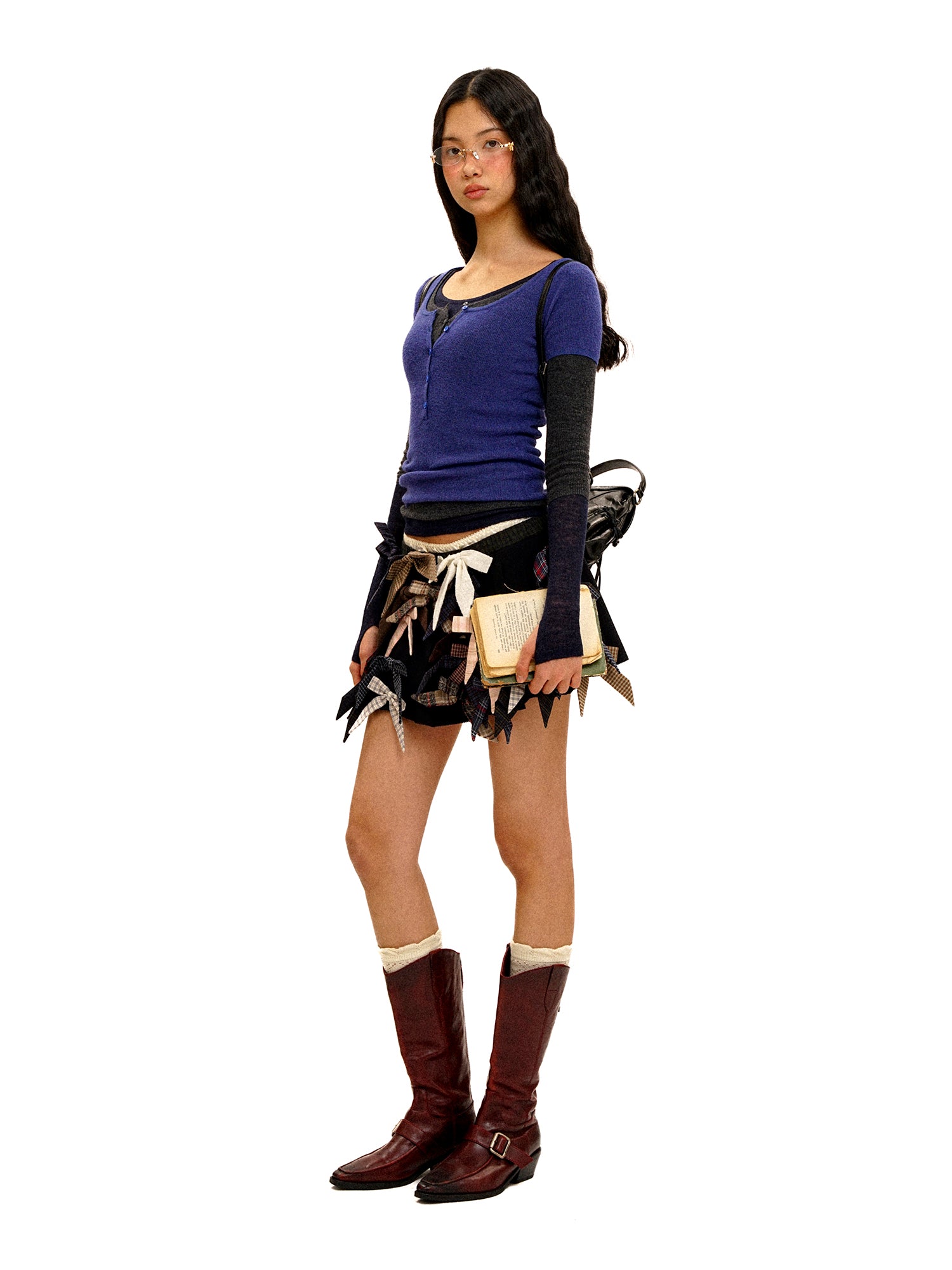 *Multi-bow pleated mini skirt