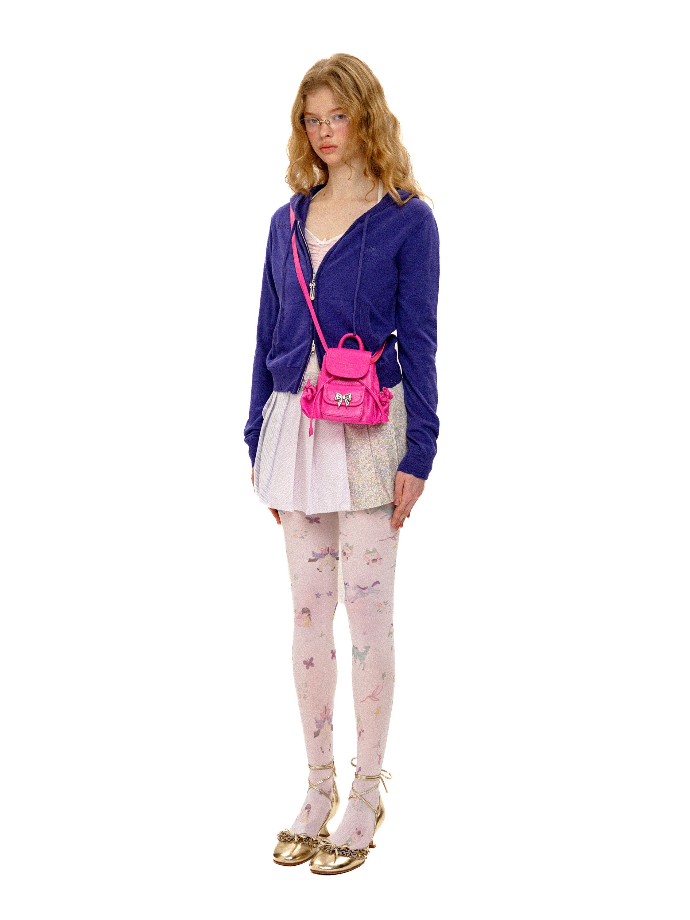 *Pleated mini skirt with ruffled trim