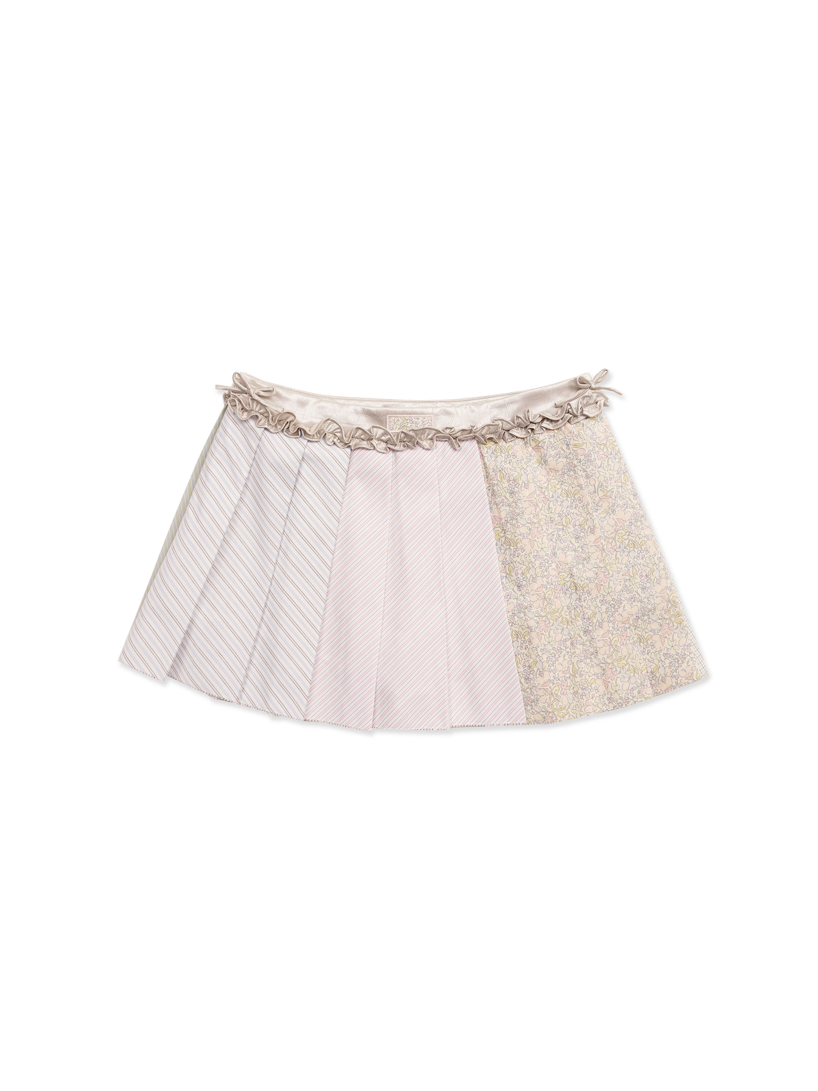 *Pleated mini skirt with ruffled trim